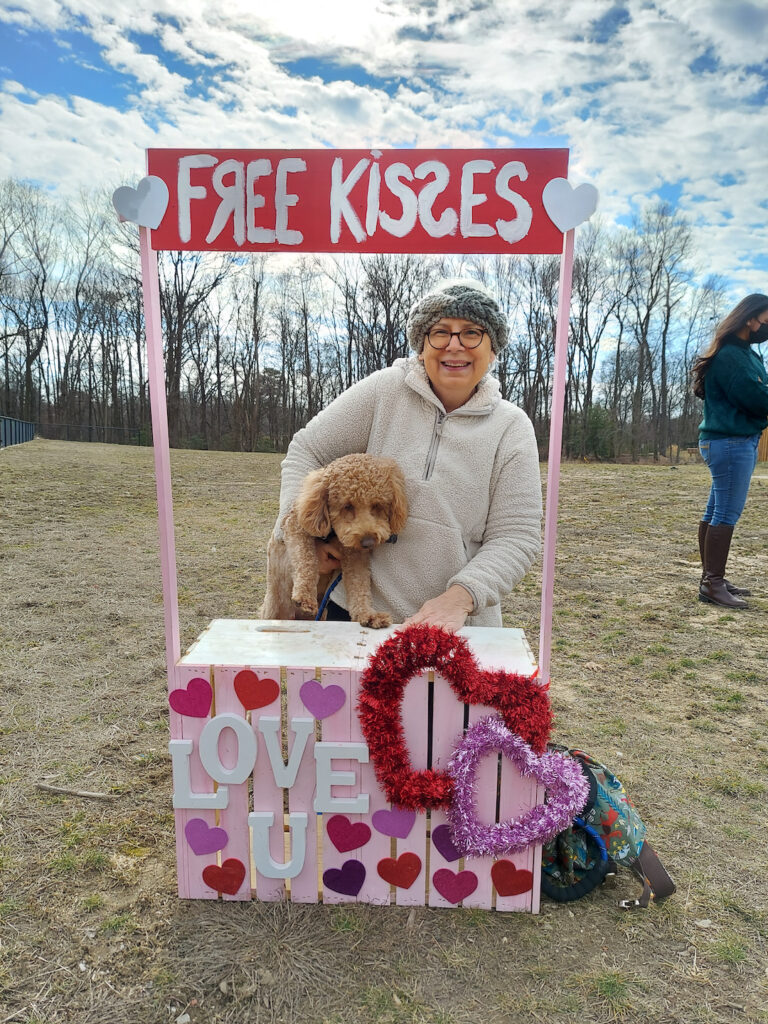 jeanne with dog at kissing booth