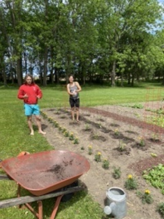 Shirlee's son and girlfriend in her vegetable garden